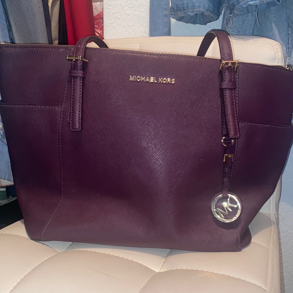 Gently used Michael Kors Tote (Purple) lots of room on the inside with pockets